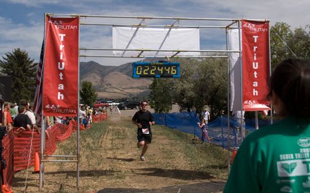 Curtis J. Morley crossing the finish line of the Ogden Valley Triathlon